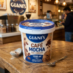 Giani's Café Mocha ice cream tub with coffee beans and chocolate curls on label on wooden table